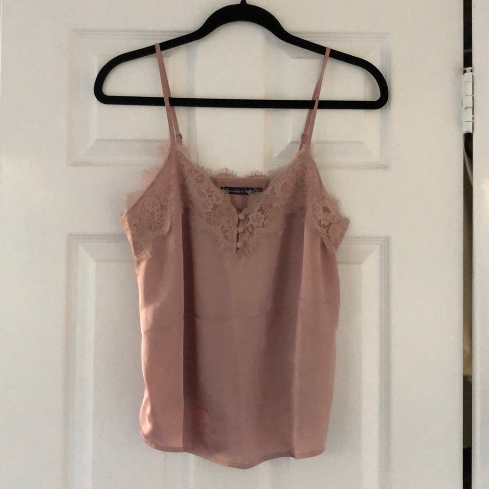 Blush camisole with lace detail.
